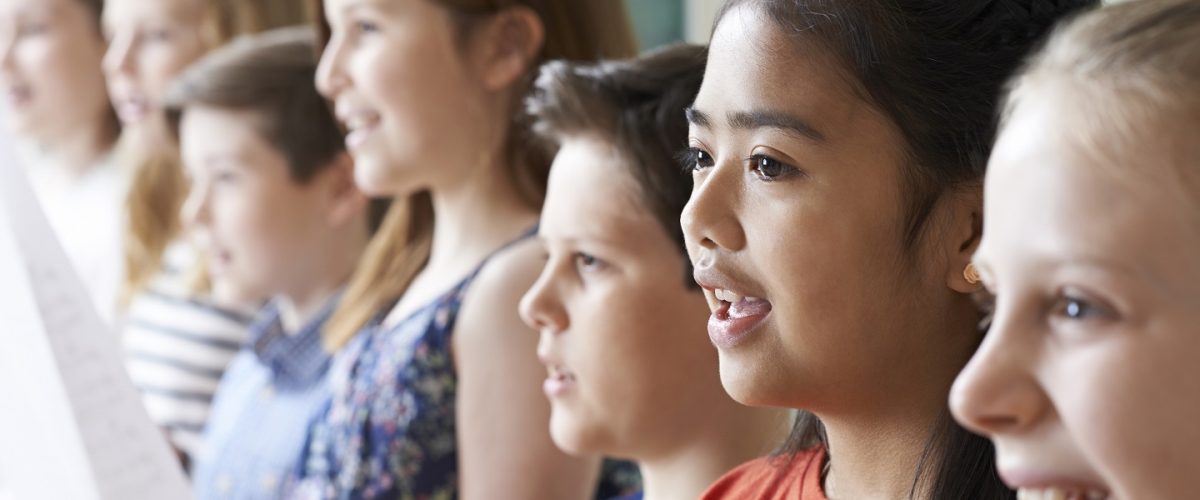 Group Of Children Enjoying Singing Group