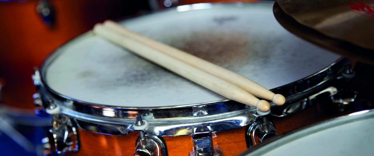 drum sticks on a snare drum in a music band